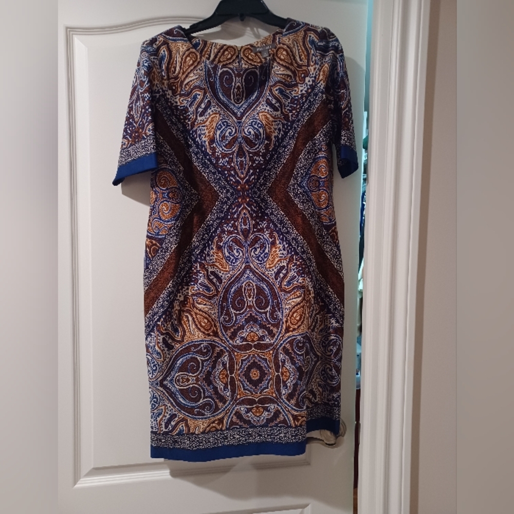 Dress with sleeves.  It is 95% polyester and 5% spandex.